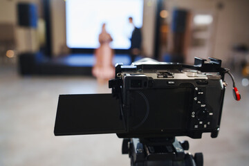 Camera ready for a presentation at a conference held in a modern venue