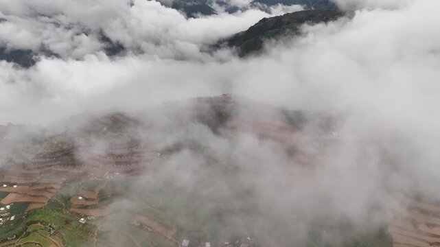 Aerial view of foggy mountain summit at Mt. Olis, Atok, Benguet, Philippines, 4k drone video