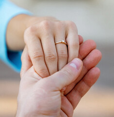 Hands of a freshly married couple