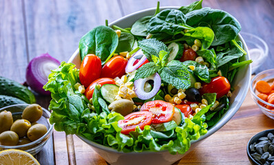 Composition with a vegetable salad bowl