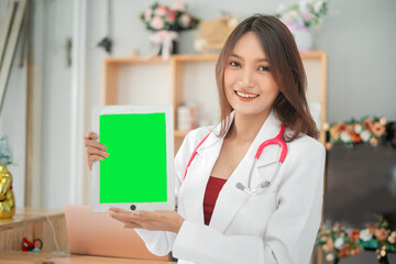 Smiling Female Veterinarian look at camera Holding Digital Tablet with Green Screen