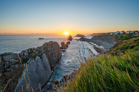 Colorful sunrise at Urros de Liencres, Cantabria, Espana