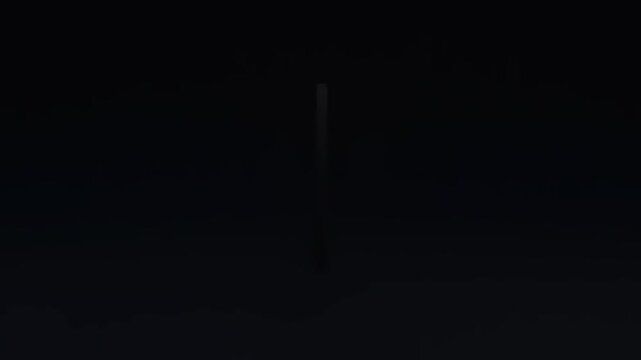 Illuminated torch symbol glowing against a dark background, representing hope and enlightenment