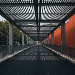 Obraz premium Modern pedestrian walkway stretches beneath a linear metal canopy.