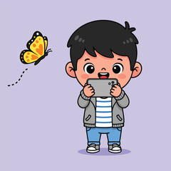 Naklejka premium A cute cartoon boy happily takes a photo of a yellow butterfly with his smartphone.