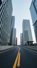 Obraz premium Urban highway stretches between modern glass skyscrapers.