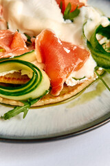 Delicious Dish Featuring Fresh Vegetables, Creamy Texture, and Savory Salmon, Perfectly Styled for an Appetizing Experience on a Fine Dining Plate