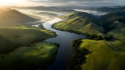 Drone view of winding lake sunrise snaking through lush green valley morning mist rising water surface sun casting long natural shadow across hilly terrain photo realistic detail enhanced depth