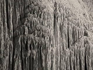 limestone formation in a cave looking like a frozen waterfall