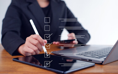 Businesswoman mark checkboxes, Survey form, check marks on checklist,Checklist concept.