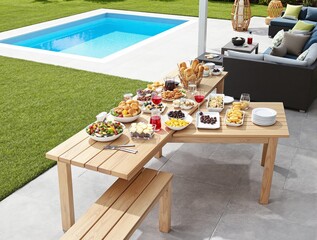Outdoor dining spread with fresh food and a poolside view.
