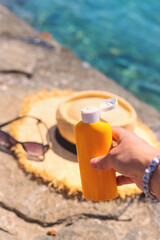 Sunscreen against the sea. Selective focus.