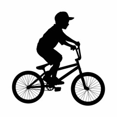 Obraz premium Silhouette of a Boy Riding a Bicycle