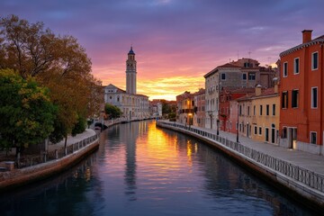 Venice canal view at dusk Buildings line waterway with sunset reflecting on the water