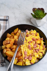 scramble eggs  and  diced spam with home fries