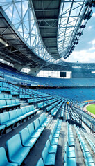 Naklejka premium Wide-angle view of light blue stadium seats 