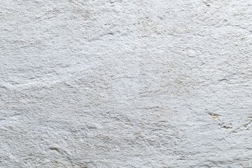 White stucco wall with rough texture and small indentations
