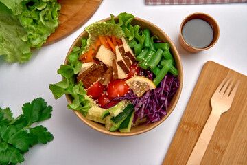 A Colorful and Nutritious Salad Bowl Featuring Fresh Vegetables, Tofu, and a Delicious Dressing Perfect for Healthy Eating and Vibrant Meals