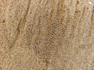 Uneven sand texture, beach background