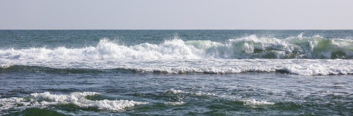 The ocean is calm and the waves are small