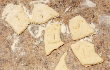 A close up of a table with a pile of dough on it