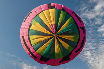 Colorful hot air balloon against blue sky pink yellow