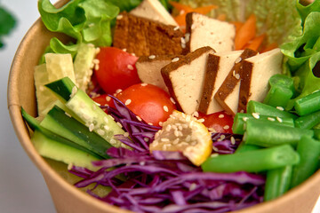 A Colorful and Nutrient-Rich Salad Bowl Featuring Fresh Vegetables, Tofu, and Tasty Ingredients for a Healthy Meal Experience