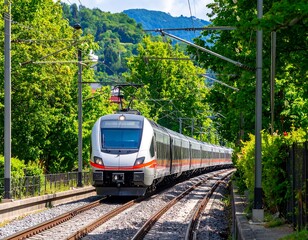 Obraz premium Modern train on tracks, lush green trees and hills