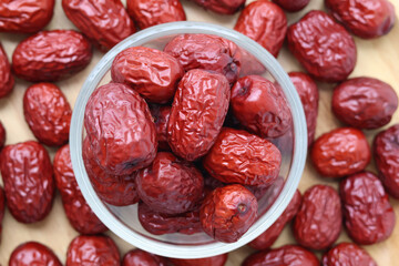 Closeup and Top view Natural sweet dried jujube in a glass cup. Healthy fruit
