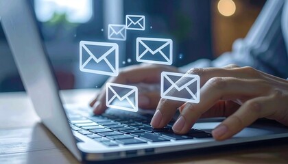 Hands Typing on Laptop with Email Icons Floating Above Screen