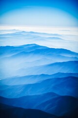 Blue mountains receding into the hazy distance