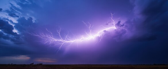 The dramatic lightning bolt illuminating a stormy purple sky.