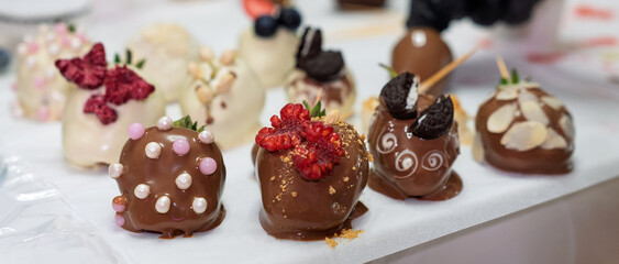 Gourmet Chocolate Strawberries with Toppings on Display