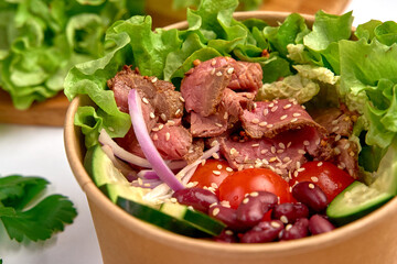 A Fresh and Nutritious Salad Bowl Featuring Tender Meat, Crisp Vegetables, and Flavorful Herbs for a Well-Balanced Meal Experience