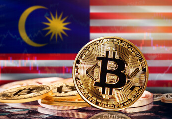 Bitcoin with Malaysia flag in the background. Investors in cryptocurrency and Blockchain Technology...