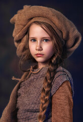 Girl in vintage rustic costume with braided hair portrait in poetic old-world style