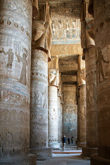 Hypostyle Hall at Dendera Temple supported by 24 sistrum-headed Hathor columns, showcasing ancient Egyptian architecture and iconography