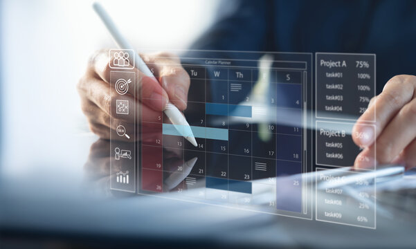 Business planning calendar agenda work schedule and project management concept. Businessman manages time for effective work with calendar, business event planning. Time management