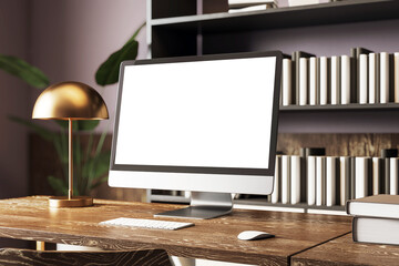 Modern desktop computer mockup with blank screen on wooden desk in stylish home office with bookshelves and golden lamp in background. 3D Rendering