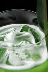 Refreshing macro shot of lemon, mint, and bubbles in a sparkling drink. Perfect for beverage ads, summer concepts, and healthy lifestyle visuals.