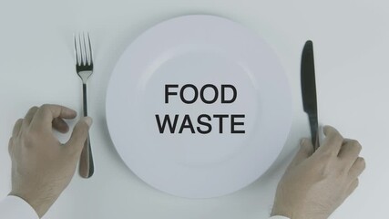Food Waste word on a plate with hands holding fork and knife on white background, symbolizing sustainability, resource management, and environmental awareness concept illustration