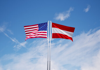 flags of  austria and United States of America over blue sky background.