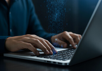  Hands typing on a laptop with abstract glowing binary code streams, symbolizing data processing, programming, and digital transformation.