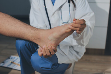 Physical therapist teaching a patient how to do exercises for his knee pain