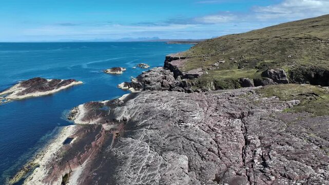 aerial view of rocky cliffs and calm  sea at Rua Reidh point  in Northern Scotland, UK
