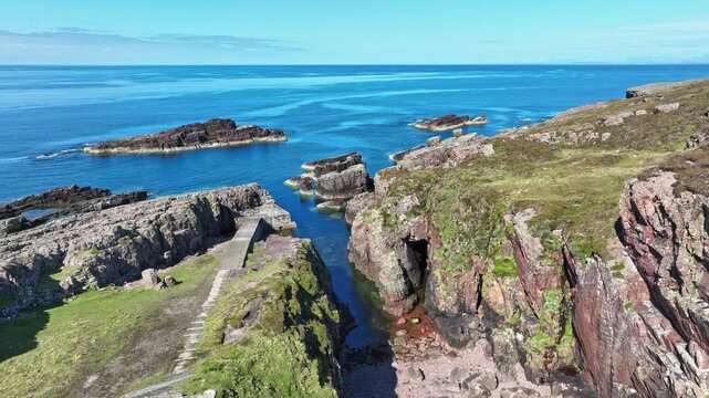 aerial view of rocky cliffs and calm  sea at Rua Reidh point  in Northern Scotland, UK
