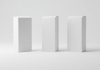 Three blank white rectangular boxes arranged on a white surface
