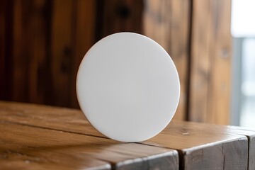 Beer coaster mockup on wooden background, customizable round paper pad for logo design, pub or bar branding template, absorbent coaster on rustic wood surface, craft beer drinkware scene