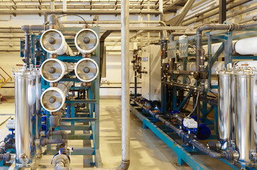 Modern industrial reverse osmosis water purification system inside a clean facility equipped for efficient water treatment