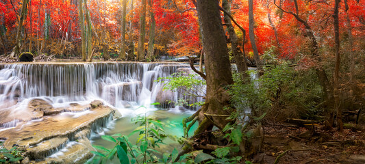Amazing in nature, beautiful waterfall at colorful autumn forest in fall season	